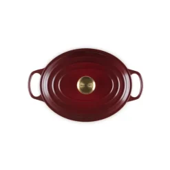 Cocotte en Fonte Ovale 29 cm Garnet Bouton Doré Le Creuset Signature